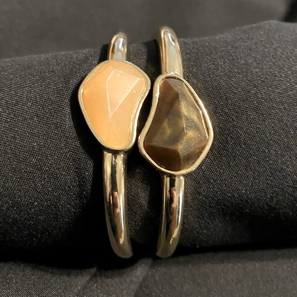 Gold bangles with peach and brown gems